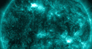 Two almost simultaneous solar flares explode from opposite sides of the sun