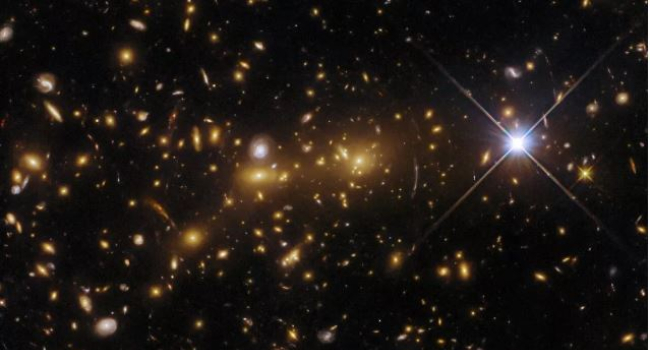 Hubble captures astonishing view of "cosmic monster" galaxy cluster unveiling secrets of the early universe