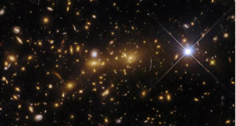 Hubble captures astonishing view of "cosmic monster" galaxy cluster unveiling secrets of the early universe