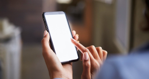 How can you detect a hidden camera using a smartphone?